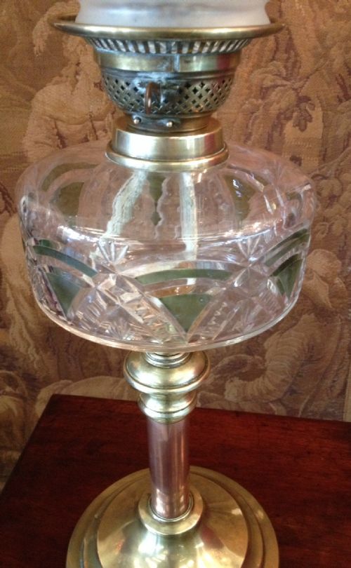 fig 1. Victorian oil lamp with brass and copper column cut glass font and etched shade 
