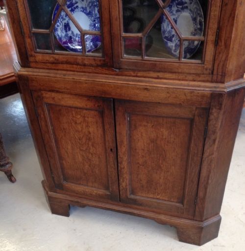 fig 1. Georgian floor standing oak corner cupboard with astragal glazed top section in original condition 
