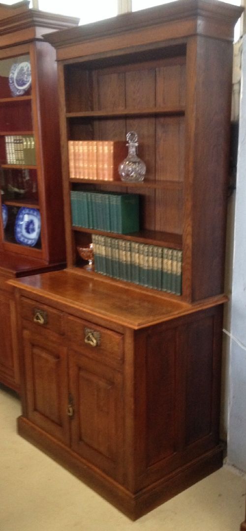 Arts and Crafts Solid Oak Bookcase Over Cupboard. Original Brass Handles