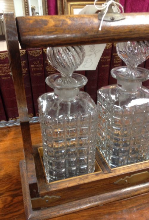 fig 1. Edwardian oak tantalus with original bottles and key
