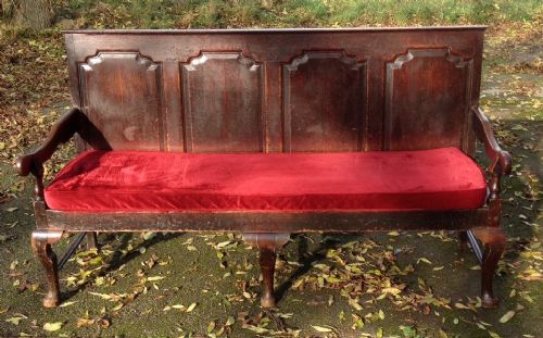 fig 1. Antique oak settle with fielded panelled back on cabriole legs circa 1830