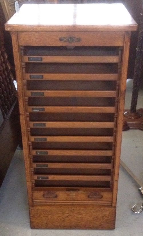 fig 1. Golden oak tambour fronted filing cabinet circa 1920'