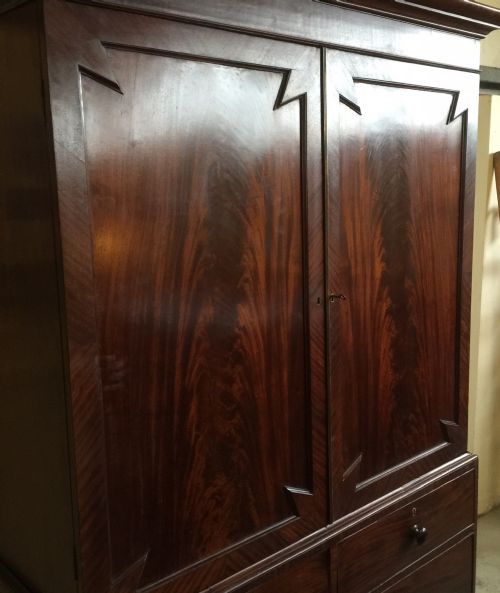 fig 1. Nineteenth century flame mahogany clothes press