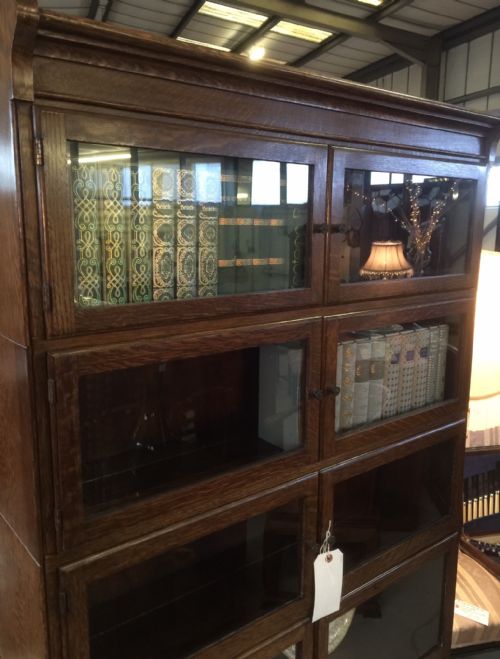 fig 1. Antique oak six height Minty bookcase circa 1920 (one of a pair)