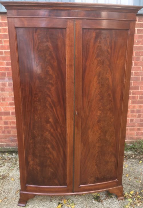 fig 1. Edwardian flame mahogany bow fronted wardrobe circa 1910