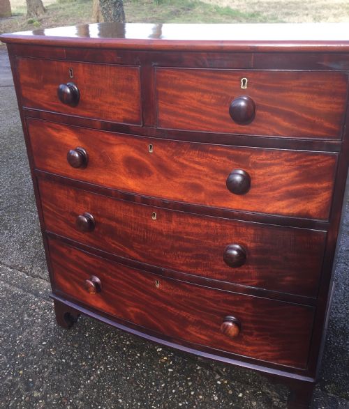 fig 2. Antique Georgian flame mahogany bow front chest of drawers