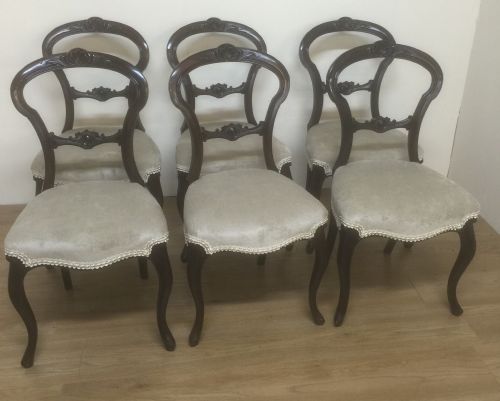 Six Victorian Simulated Rosewood Balloon Back Chairs.