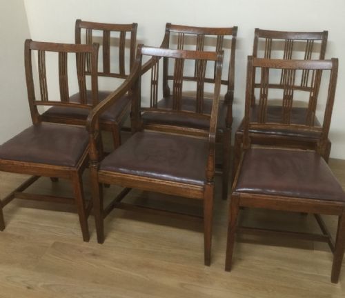 Arts and Crafts Golden Oak Set of Six Dining Chairs Including Two Carvers