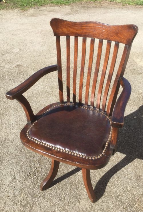 Edwardian Oak Desk Chair Burgundy Leather Seat.