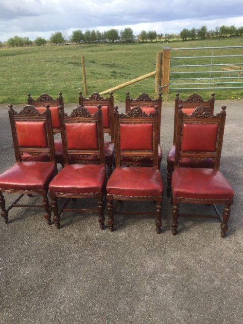 Set of Eight Victorian Carved Oak Dining Chairs in Red Leather Circa 1880