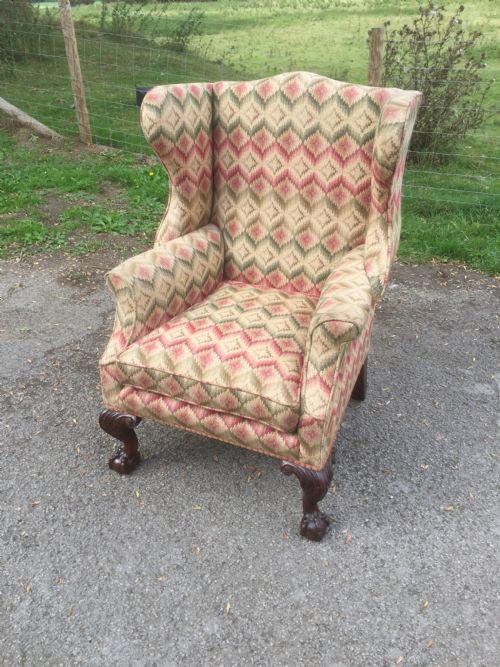 Edwardian Traditionally Upholstered Winged Armchair on Carved Ball and Claw Feet