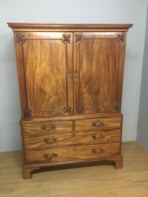 Nineteenth Century Flame Mahogany Linen Press of Small Proportions