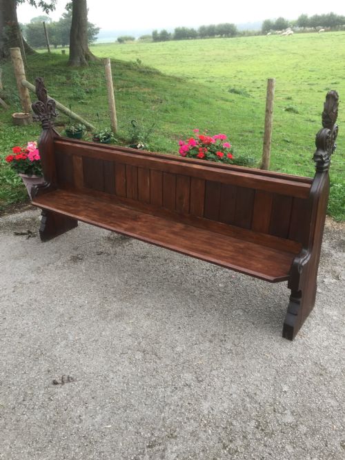 Nineteenth Century Pine Pew with Carved Fleur De Lys Finials