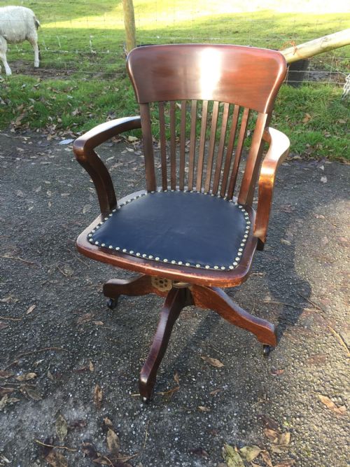 Slat Back Swivel Office Chair with Leather Seat  Circa 1920