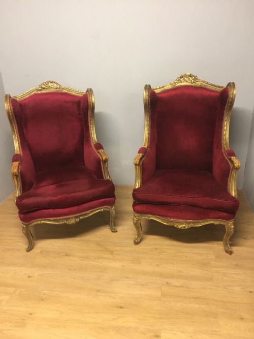 Pair of Late Nineteenth Century Gilt Framed Winged Armchairs