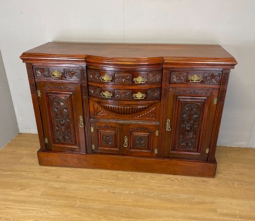 Late Nineteenth Century Carved Walnut Bow Fronted Sideboard