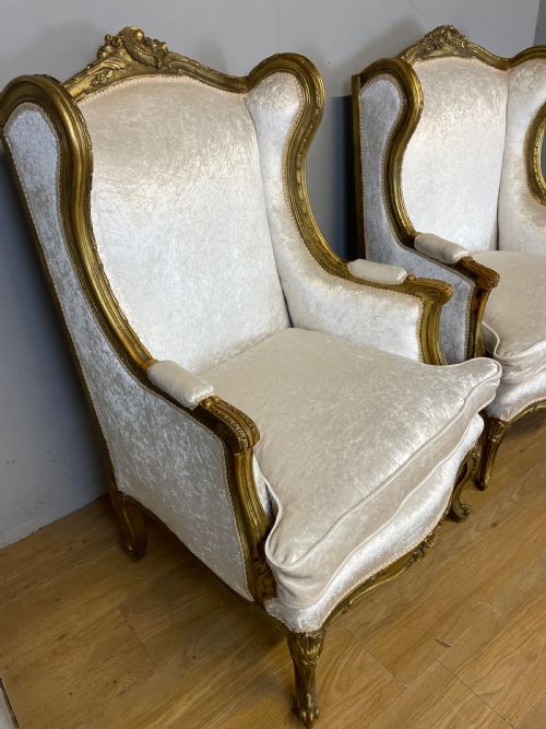 EARLY C20TH PAIR OF CARVED AND GILDED FRENCH WINGED ARMCHAIRS - ADDITIONAL PHOTO 3