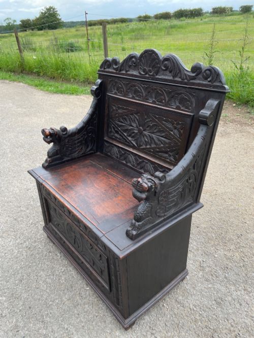 C19TH CARVED OAK BOX SETTLE OF SMALL PROPORTIONS - ADDITIONAL PHOTO 5