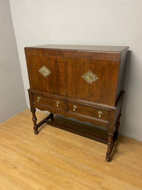 SOLID OAK JACOBEAN STYLE SIDE CABINET CIRCA 1920