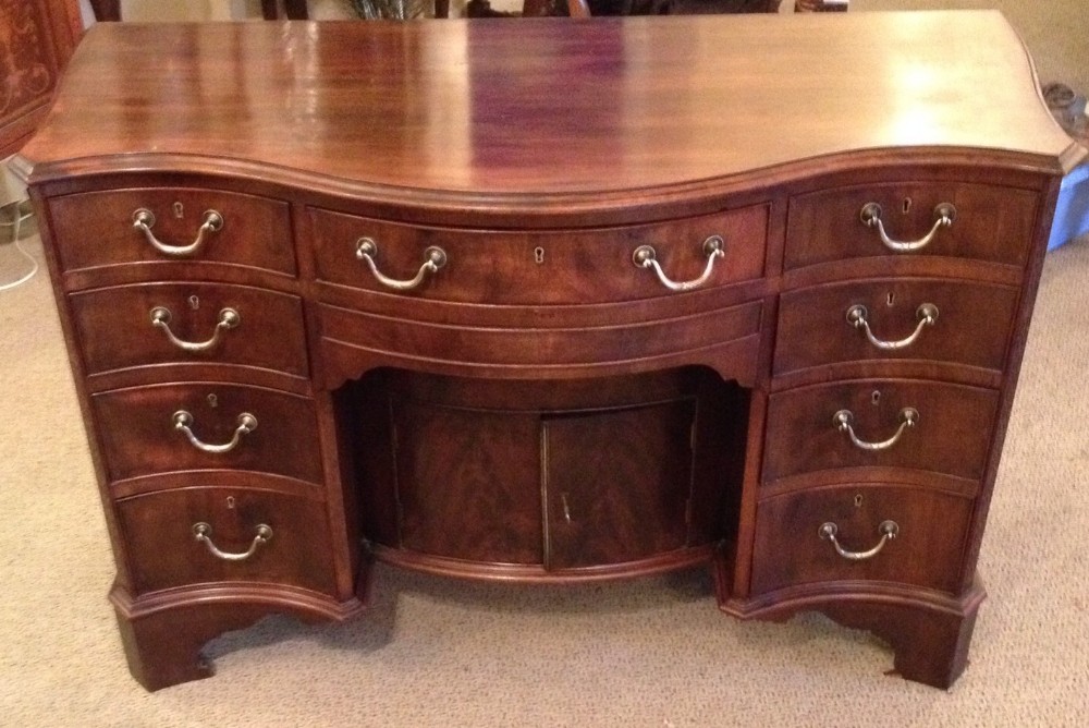 Antique late Georgian serpentine fronted  mahogany desk 
