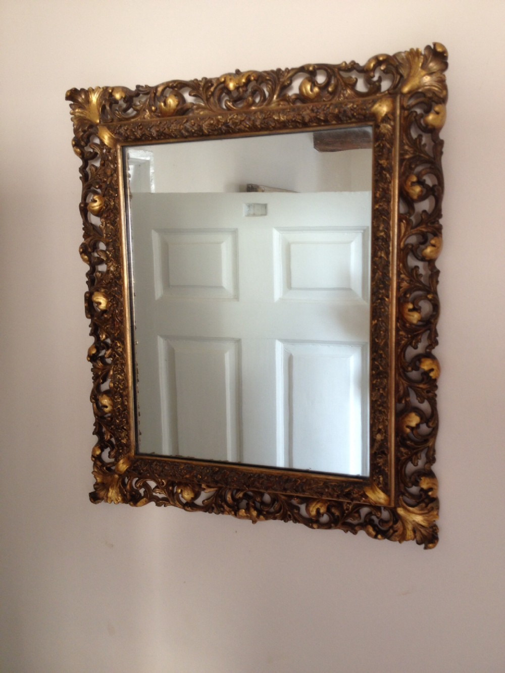 Antique Victorian gilt framed mirror with pierced foliate decoration.
