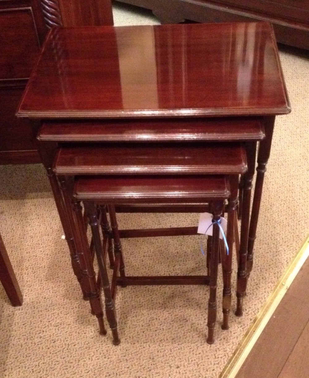 Antique Edwardian nest of four tables on turned legs . Repolished