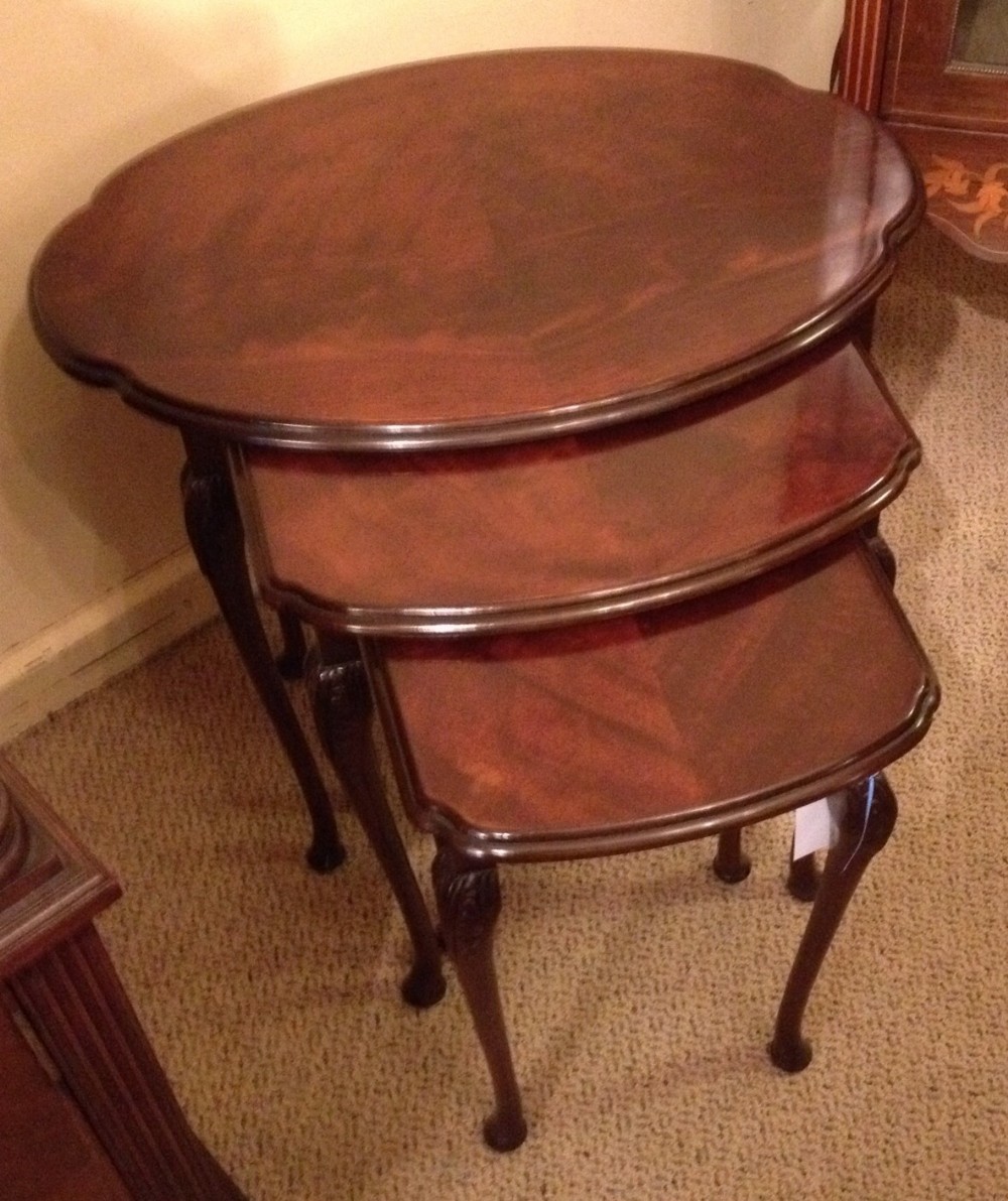 Mahogany nest of three tables with figured mahogany tops. Repolshed