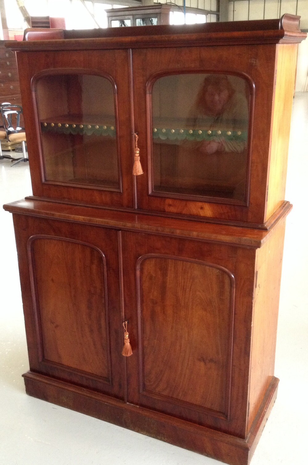 Antique mahogany  bookcase over cupboard in original condition of small proportions 