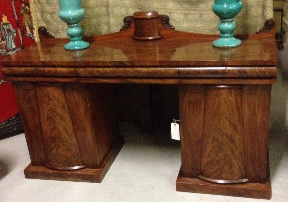 Late Regency flame mahogany twin pedestal sideboard