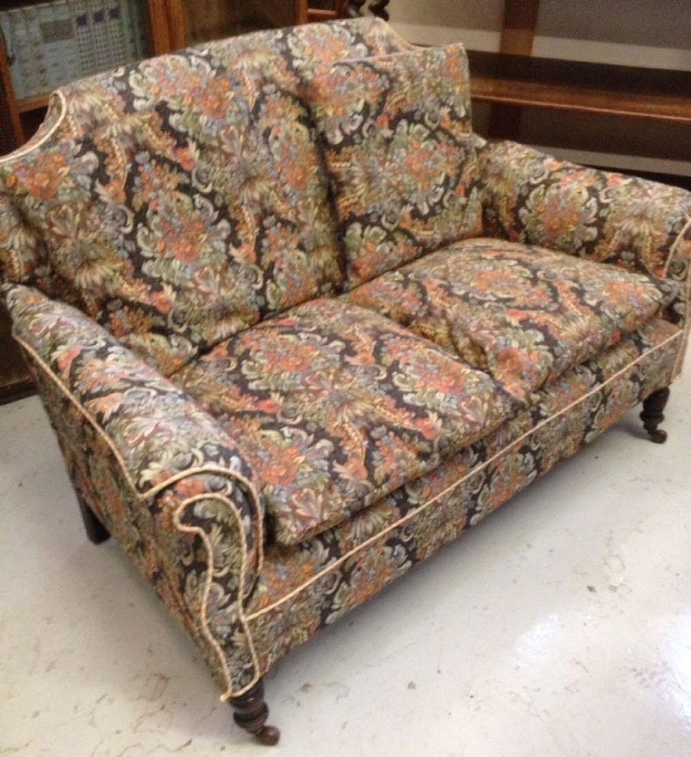 Victorian two seater sofa on tuned legs Original casters
