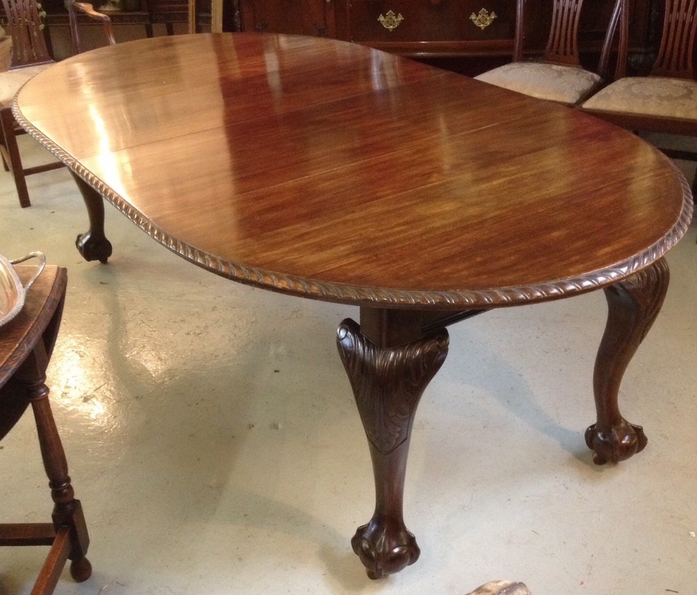 Eight seater walnut wind out dining table with two leaves circa 1890