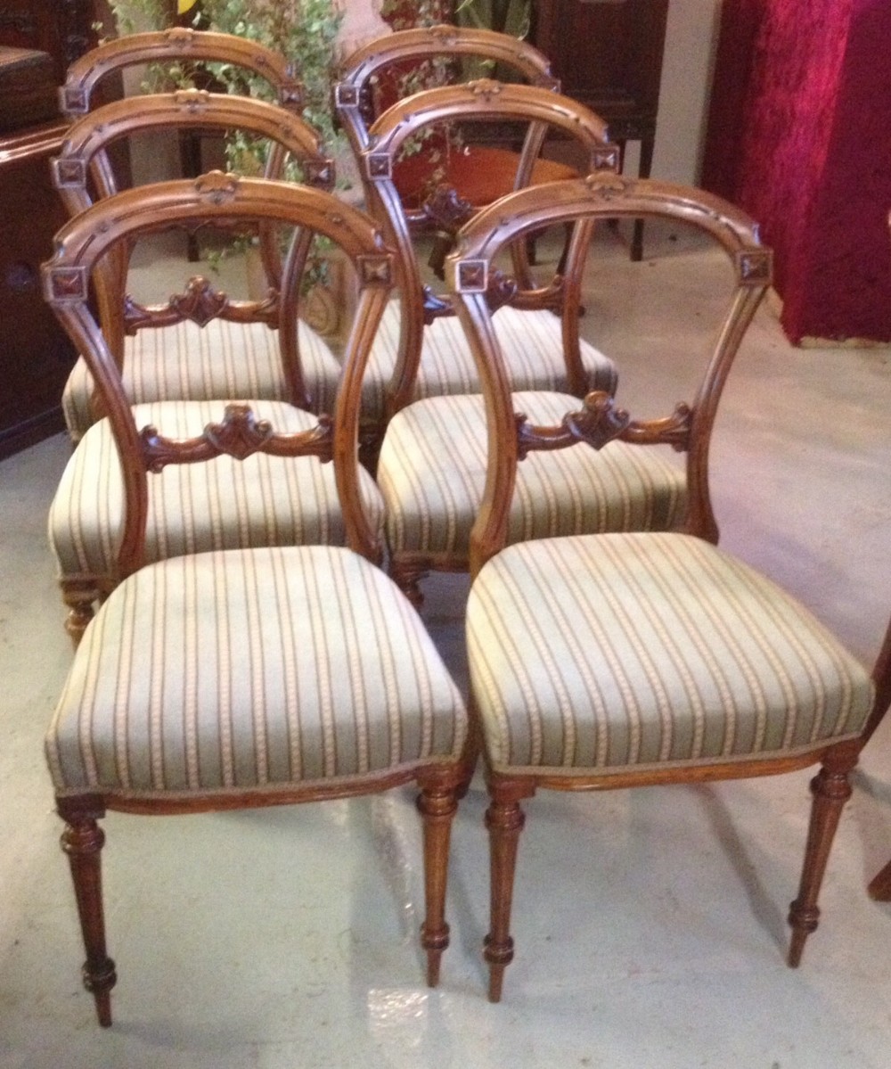 Set of six Victorian walnut balloon back dining chairs