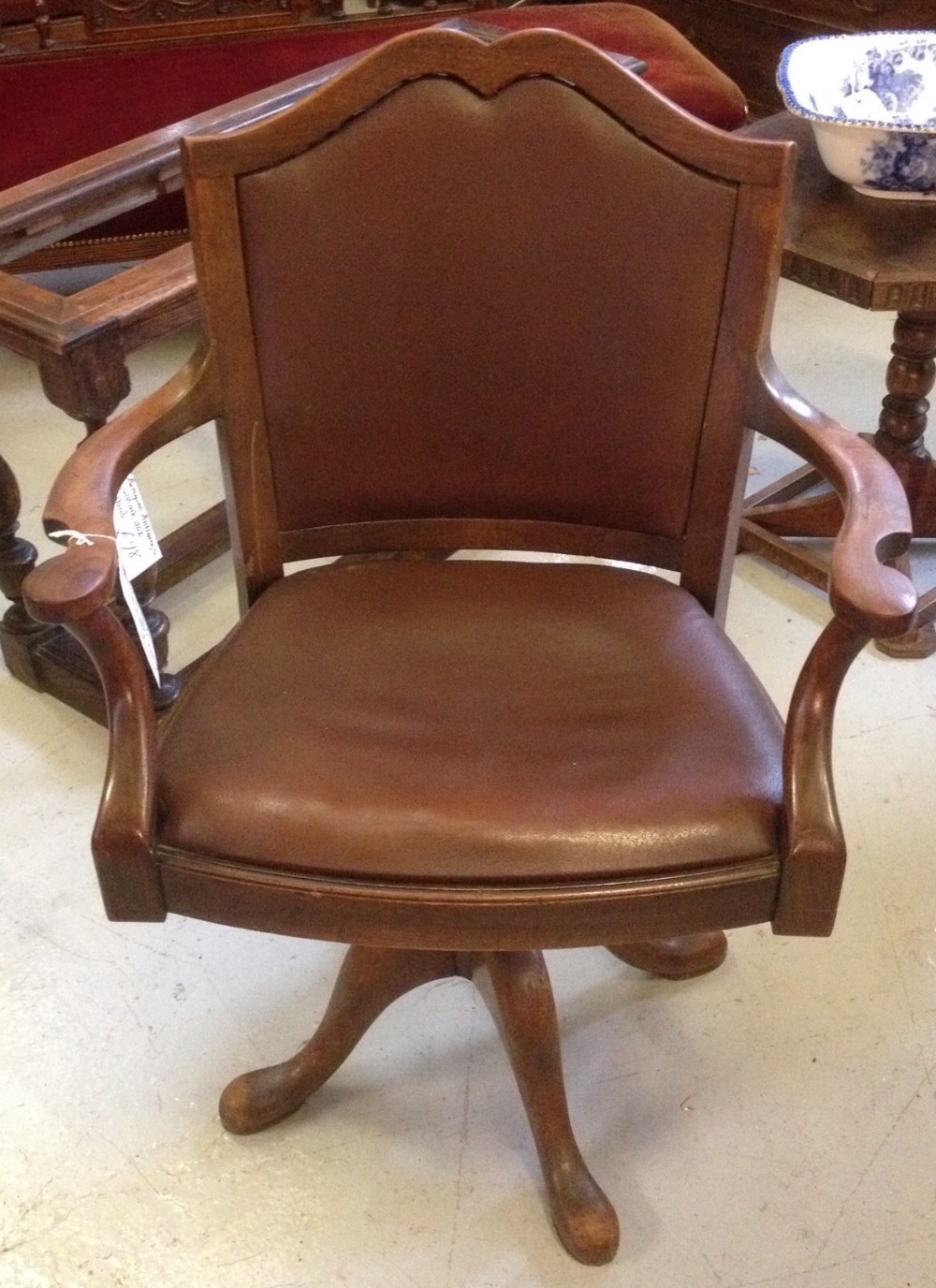 Swivel and height adjusting desk chair circa 1920