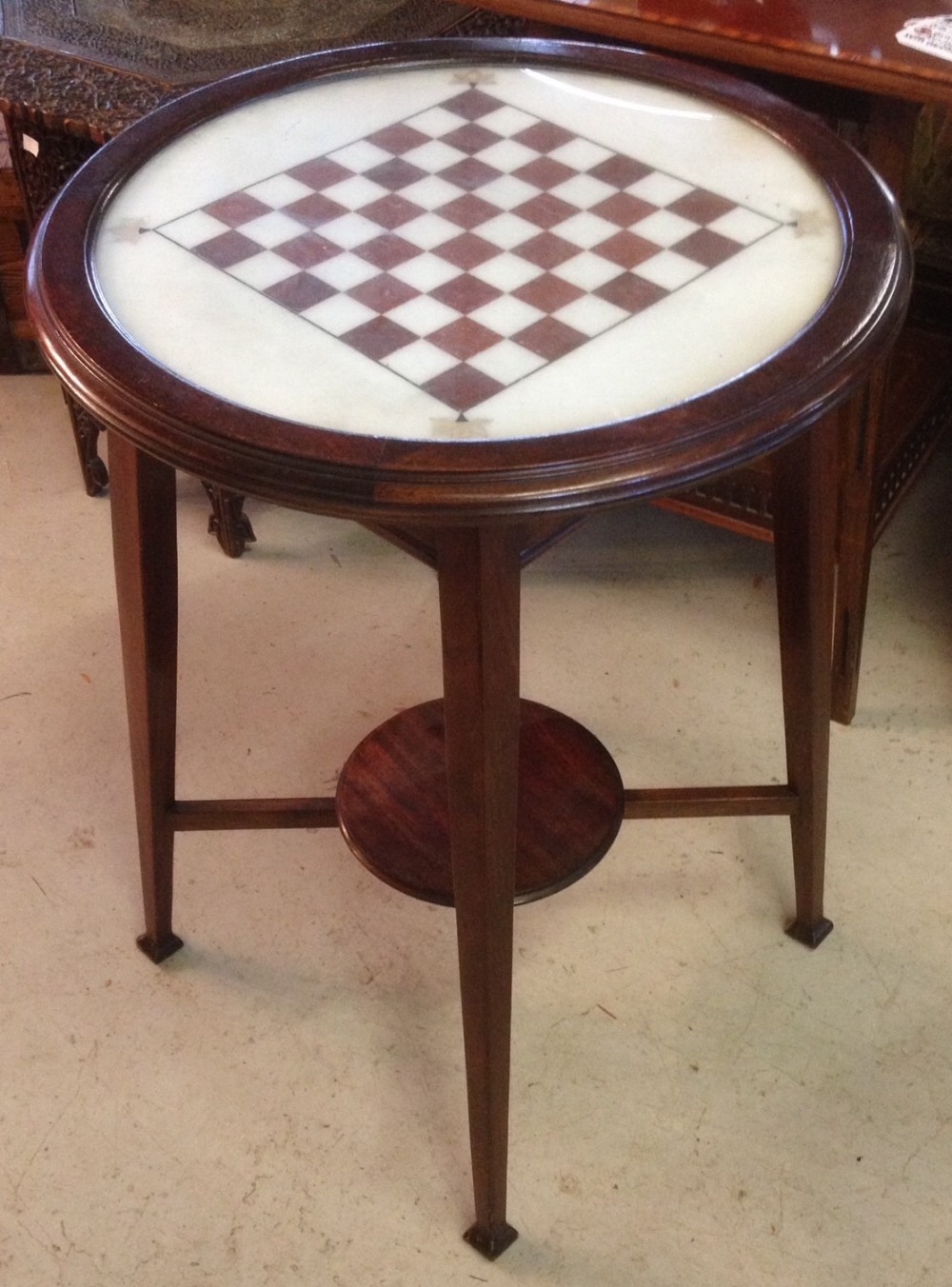 Mahogany arts and crafts marble topped games table inlaid with mother of pearl 