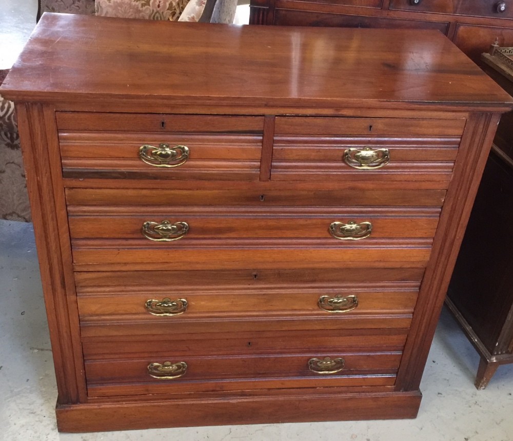 Arts and Crafts satin walnut 4 height chest of drawers