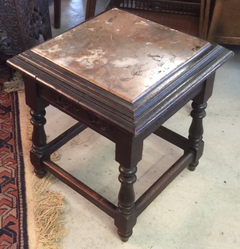 Marble topped oak stand on turned legs