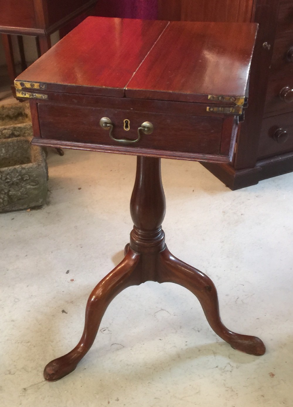 George Third mahogany writing table on tripod base