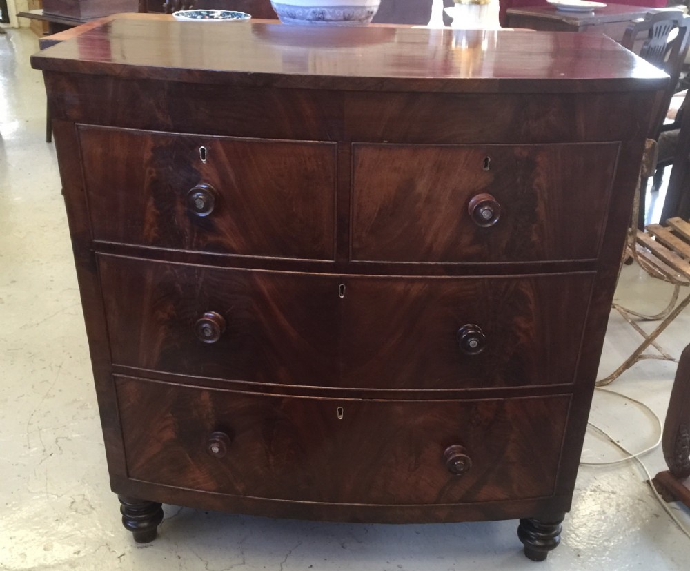 Early Victorian flame mahogany bow front chest of drawers 