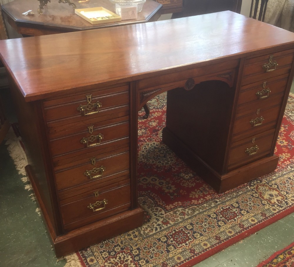 Late Victorian solid walnut twin pedestal desk 