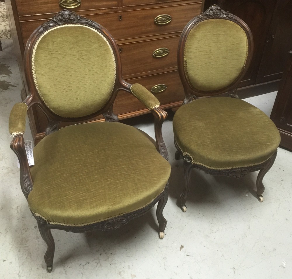 Victorian ladies and gentlemans walnut carved chairs