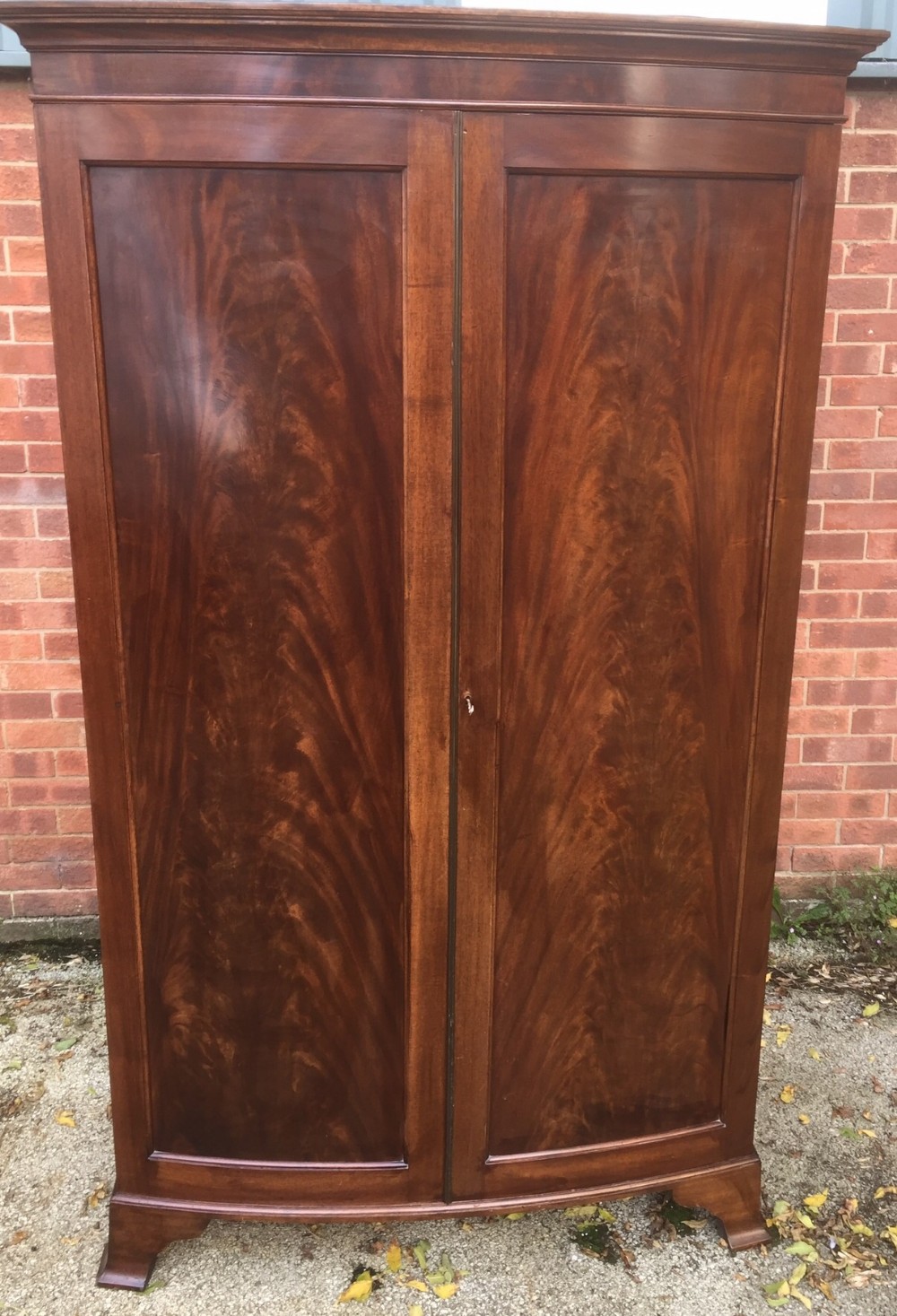 Edwardian flame mahogany bow fronted wardrobe circa 1910