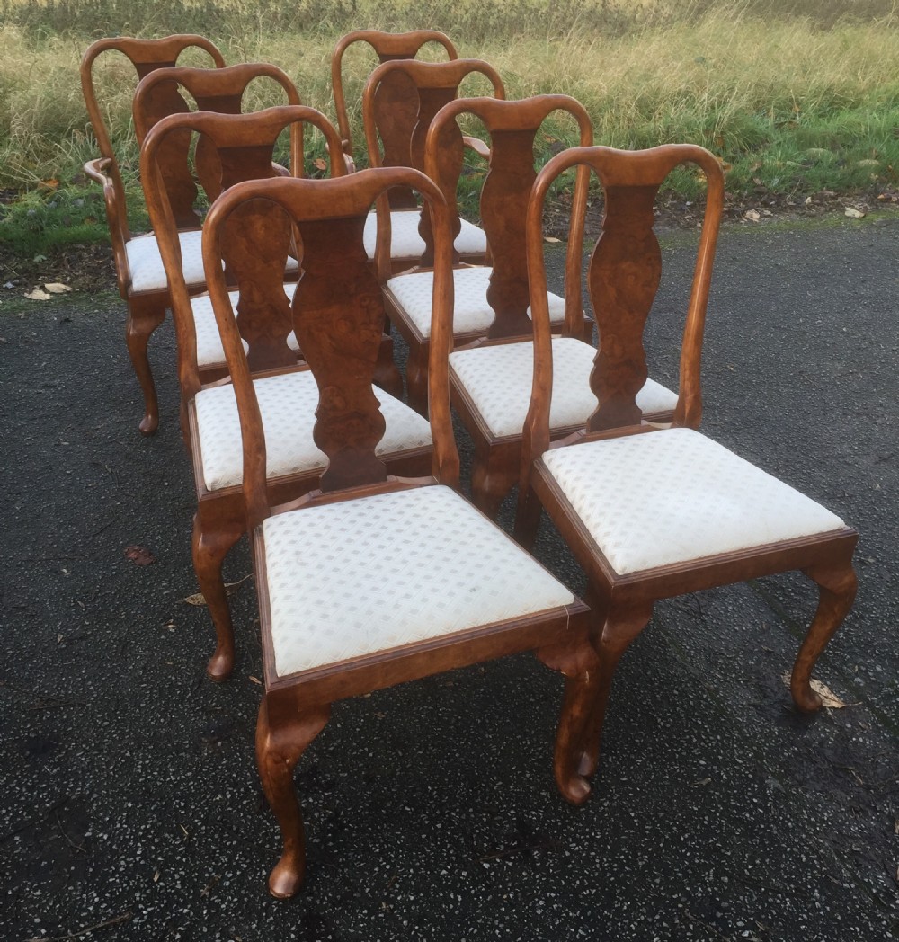 Eight Queen Anne style walnut and beech dining chairs 