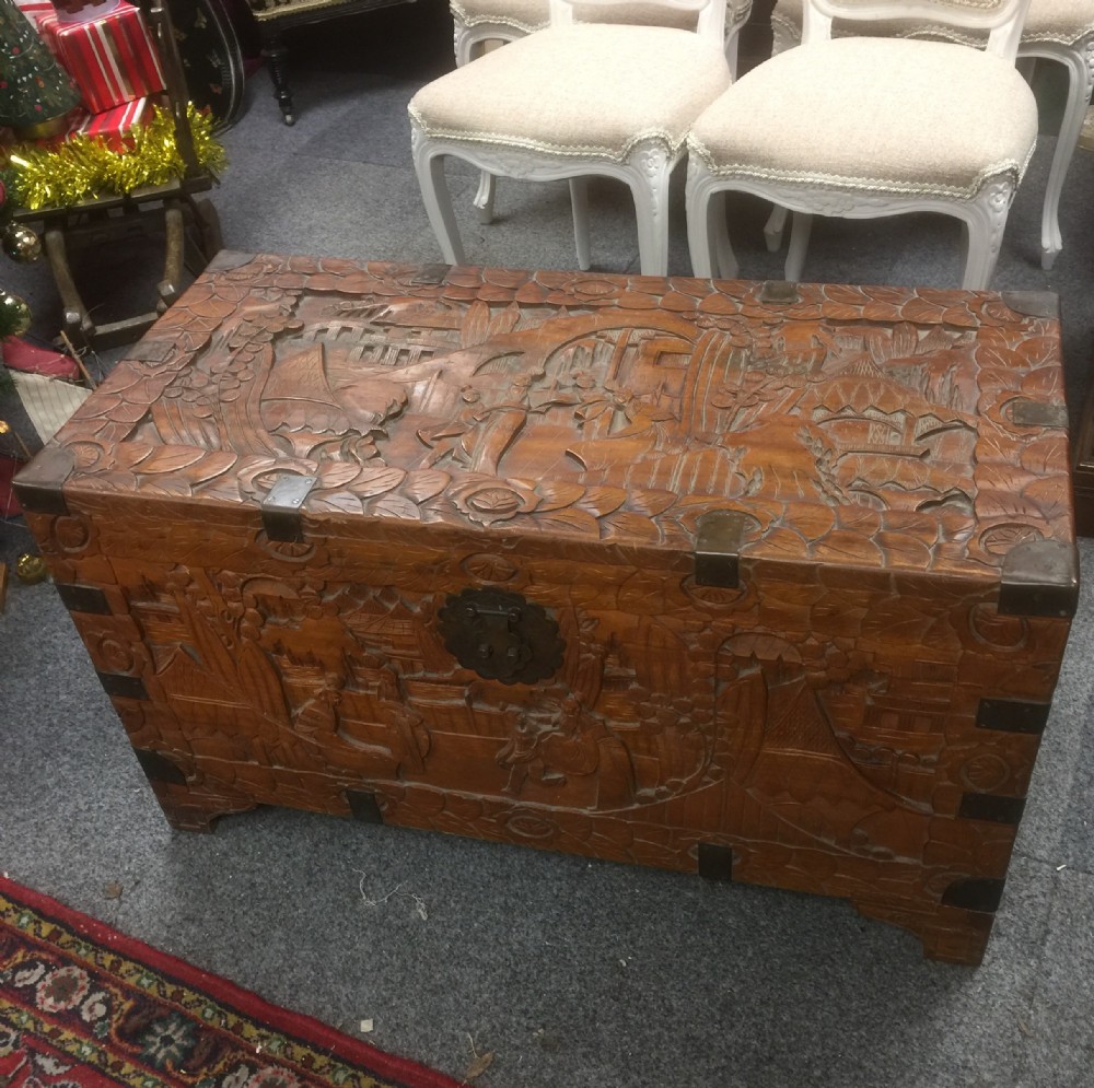 Carved oriental brass bound camphor wood chest 