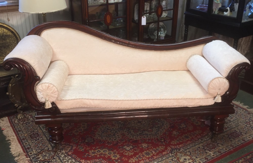 Early victorian mahogany scroll end sofa. 