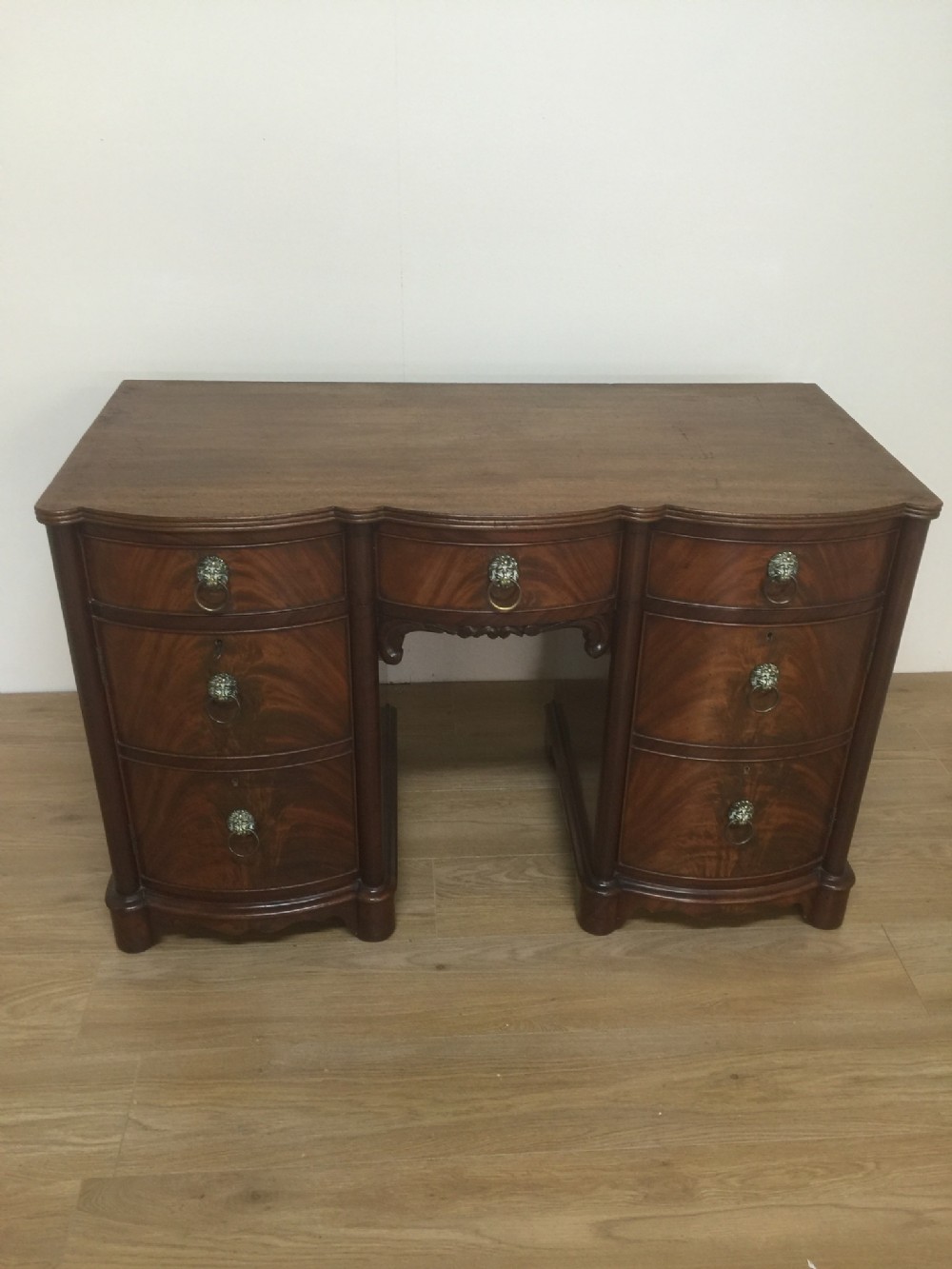 Antique Edwardian serpentine flame mahogany desk 