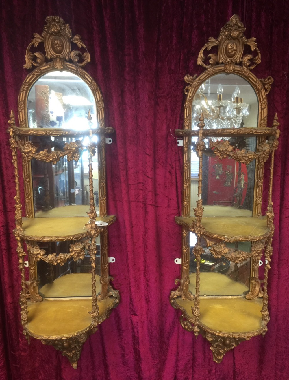 Pair nineteenth century carved giltwood three tier wall shelves 