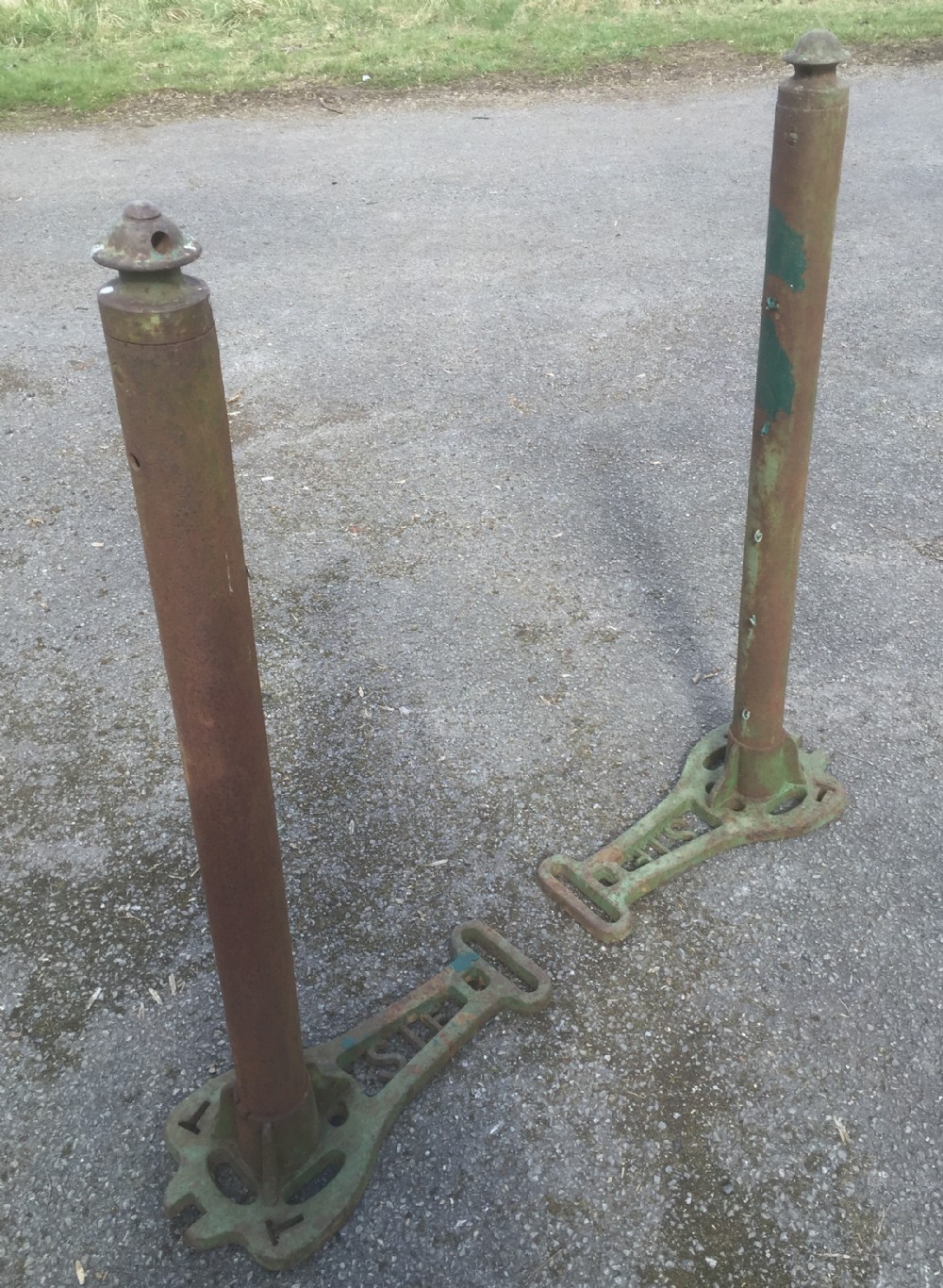 Early pair cast iron tennis net posts