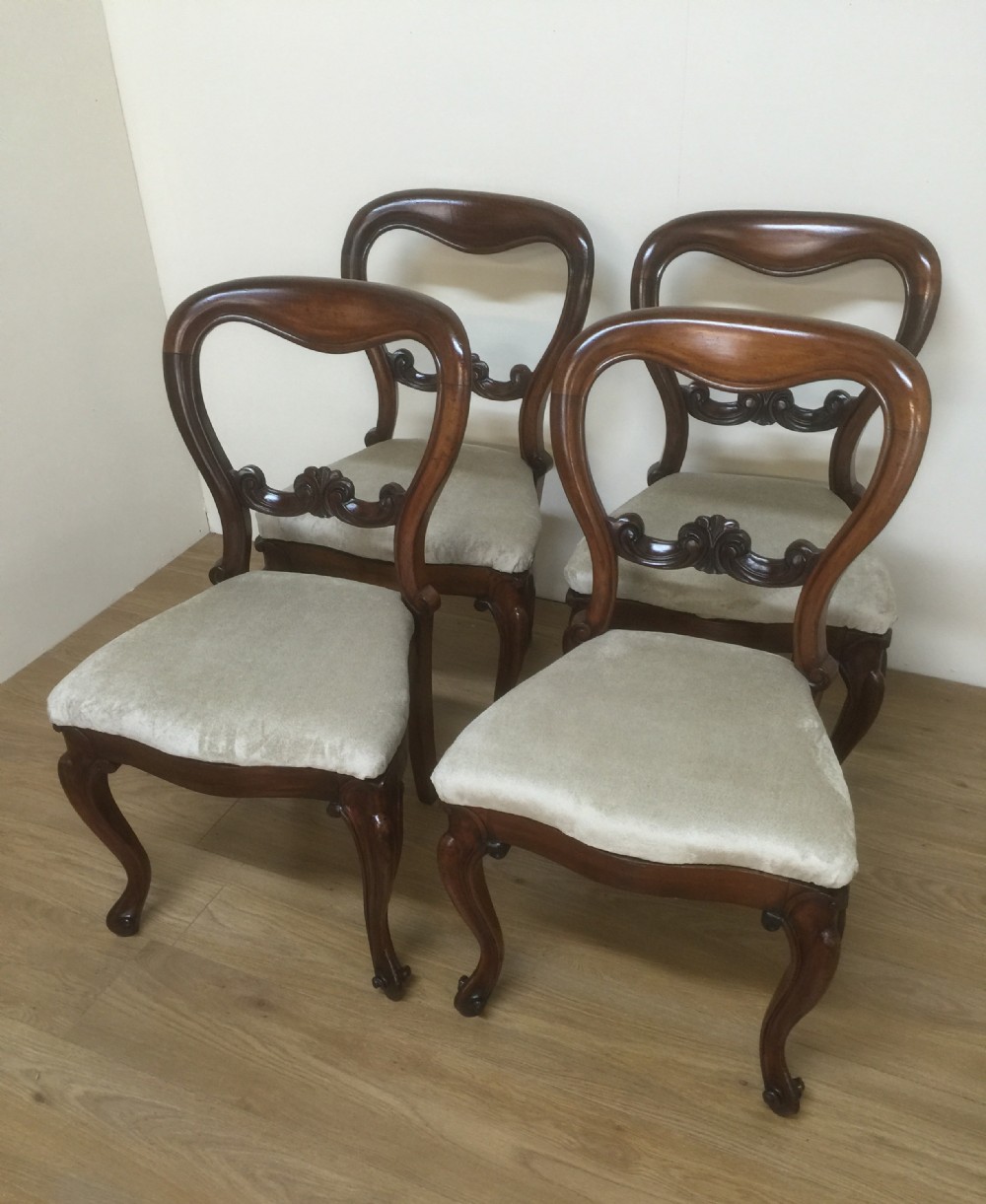 Four Victorian solid mahogany balloon back dining chairs