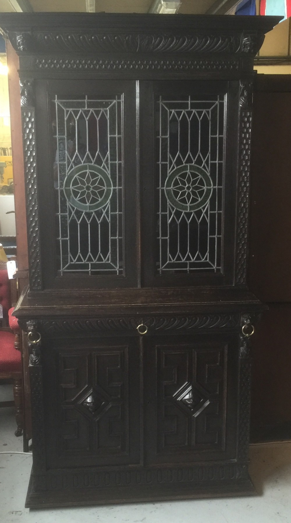 Victorian carved oak Flemish cabinet with stained glass panels