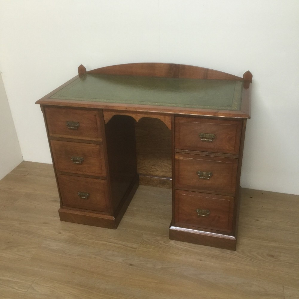 Victorian walnut twin pedestal desk with tooled leather top 